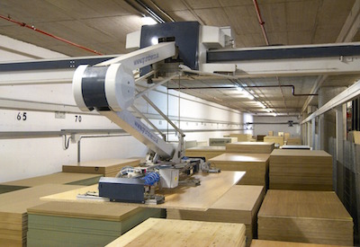 robotic arm moving goods in a warehouse